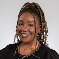 Akeia Blue Headshot 2025_No. 2_ square crop - A. Blue headshot 2025